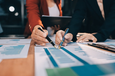 Business meeting time. Business man and business woman working on startup project.の写真素材