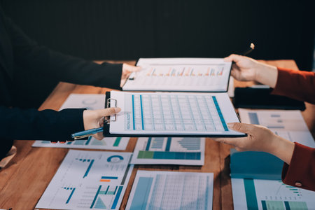 Business meeting time. Business man and business woman working on startup project.の写真素材