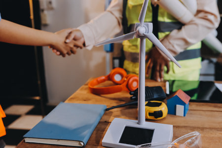 Engineers are helping to design work on blueprints and collaborate on structural analyzing of...