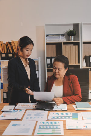 Business meeting time. Business man and business woman working on startup project.の写真素材