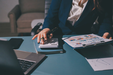 Expert woman asian female people review data number costing managerial account prepare monthly...