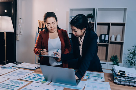 Business meeting time. Business man and business woman working on startup project.の写真素材