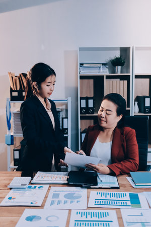 Business meeting time. Business man and business woman working on startup project.の写真素材