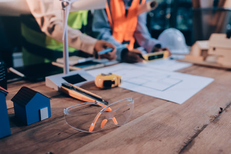Engineers are helping to design work on blueprints and collaborate on structural analyzing of...