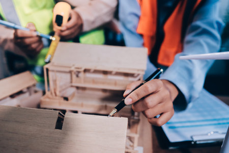 Engineers are helping to design work on blueprints and collaborate on structural analyzing of...