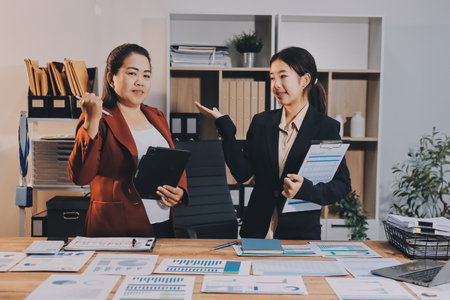 Business meeting time. Business woman and business woman working on startup project.の写真素材
