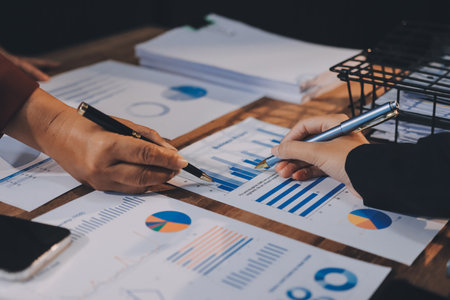 Group of business people brainstorming in analytical plan meeting Calculate the numbers obtained from the graph. Financial growth chart. Marketing. Concept of business success statistics.の写真素材