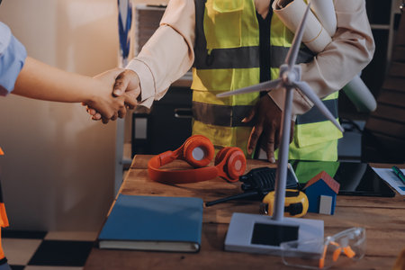 Engineers are helping to design work on blueprints and collaborate on structural analyzing of...