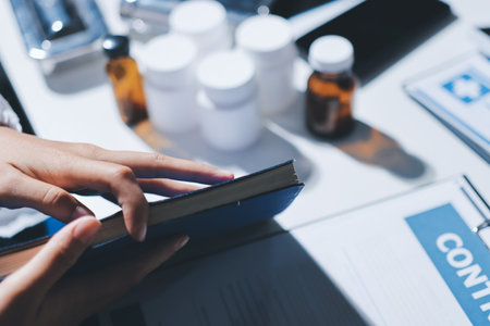 Male and female doctors are having a meeting in a hospital room.の写真素材