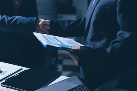 Close-up of handshake of businesswoman and businessmanの写真素材