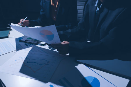 Two business people analyzing the data