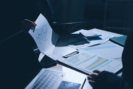 Group of business women working on a financial data expenses document.の写真素材