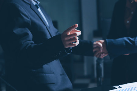 Close-up of handshake of businesswoman and businessmanの写真素材