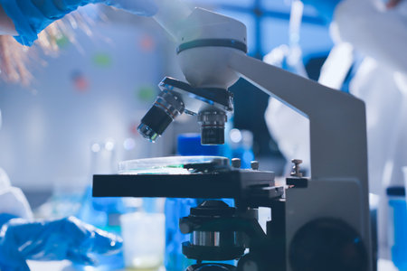 Scientist pipetting medical samples into microplate in laboratoryの写真素材