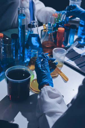Scientist pipetting medical samples into microplate in laboratoryの写真素材