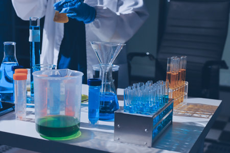 Scientist pipetting medical samples into microplate in laboratoryの写真素材