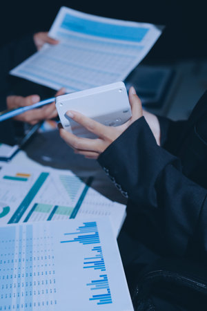 Group of business women working on a financial data expenses document.の写真素材