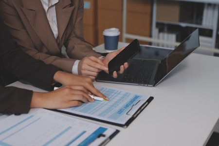 Accounting company provide finance and taxation planning for profitable cash flow, Auditor and accountant team working in office, analyze financial data and accounting record with calculator.Insightの写真素材
