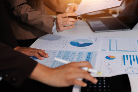 Accounting company provide finance and taxation planning for profitable cash flow, Auditor and accountant team working in office, analyze financial data and accounting record with calculator.Insightの写真素材