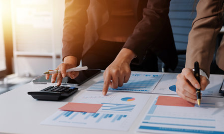 Accounting company provide finance and taxation planning for profitable cash flow, Auditor and accountant team working in office, analyze financial data and accounting record with calculator.Insightの写真素材