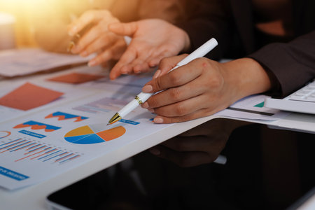 Accounting company provide finance and taxation planning for profitable cash flow, Auditor and accountant team working in office, analyze financial data and accounting record with calculator.Insightの写真素材
