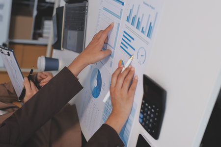Accounting company provide finance and taxation planning for profitable cash flow, Auditor and accountant team working in office, analyze financial data and accounting record with calculator.Insightの写真素材
