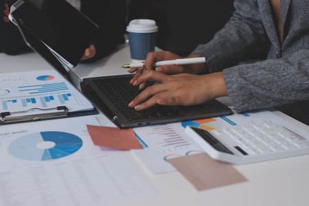Accounting company provide finance and taxation planning for profitable cash flow, Auditor and accountant team working in office, analyze financial data and accounting record with calculator.Insightの写真素材