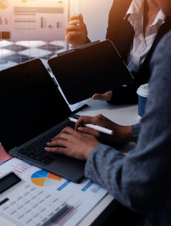 Accounting company provide finance and taxation planning for profitable cash flow, Auditor and accountant team working in office, analyze financial data and accounting record with calculator.Insightの写真素材