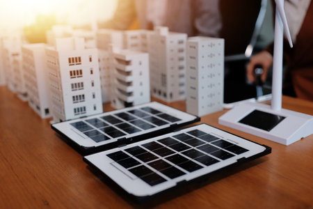 Discussion among businesspeople on the latest developments in solar cell panel technology and Solar Energy Environment city Concept.の写真素材