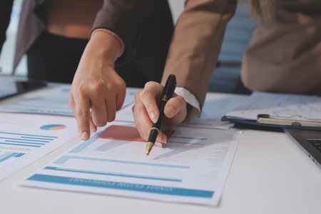 Accounting company provide finance and taxation planning for profitable cash flow, Auditor and accountant team working in office, analyze financial data and accounting record with calculator.Insightの写真素材