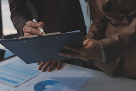 Accounting company provide finance and taxation planning for profitable cash flow, Auditor and accountant team working in office, analyze financial data and accounting record with calculator.Insightの写真素材