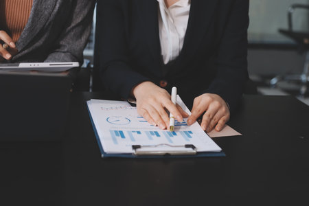 Accounting company provide finance and taxation planning for profitable cash flow, Auditor and accountant team working in office, analyze financial data and accounting record with calculator.Insightの写真素材