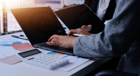 Accounting company provide finance and taxation planning for profitable cash flow, Auditor and accountant team working in office, analyze financial data and accounting record with calculator.Insightの写真素材