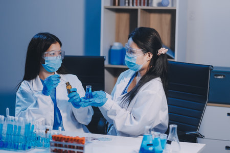 Research, experiment and medical trial being done by a scientist in a lab, science facility or hospital. One young, serious and professional researcher organizing, sorting or making a discoveryの写真素材