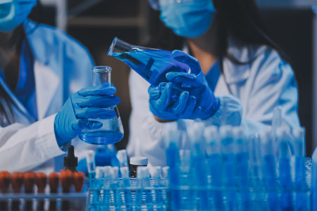 Research, experiment and medical trial being done by a scientist in a lab, science facility or hospital. One young, serious and professional researcher organizing, sorting or making a discoveryの写真素材