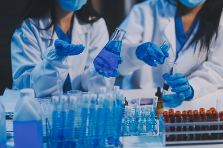Research, experiment and medical trial being done by a scientist in a lab, science facility or hospital. One young, serious and professional researcher organizing, sorting or making a discoveryの写真素材