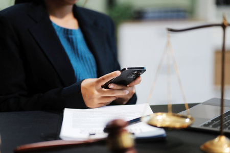 female business woman lawyers working at the law firms. Judge gavel with scales of justice. Legal law, lawyer, documents, advice and justice concept.の写真素材