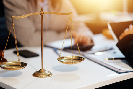 Consultation and conference of lawyers and professional businessman working and discussion having at law firm in office. Concepts of law, Judge gavel with scales of justice.の写真素材