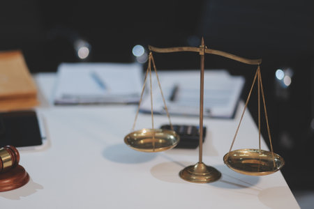 Judge gavel with Justice lawyers having team meeting at law firm background. Concepts of Law and...