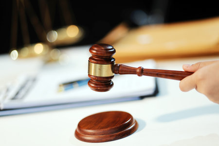 Judge gavel with Justice lawyers having team meeting at law firm background. Concepts of Law and...