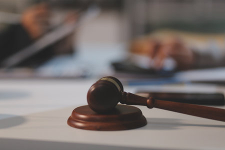 Consultation and conference of lawyers and professional businessman working and discussion having at law firm in office. Concepts of law, Judge gavel with scales of justice.の写真素材