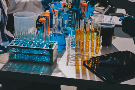 Scientist pipetting medical samples into microplate in laboratoryの写真素材