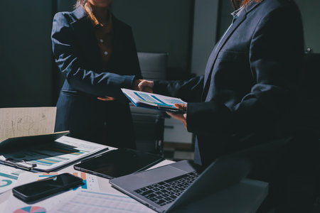 Close-up of handshake of businesswoman and businessmanの写真素材