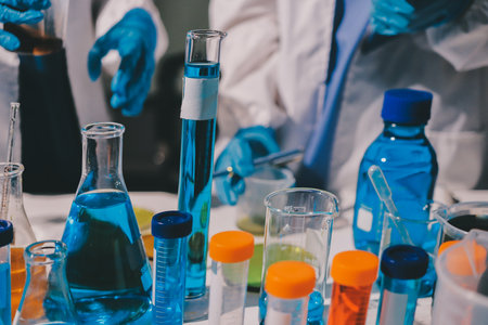 Scientist pipetting medical samples into microplate in laboratoryの写真素材