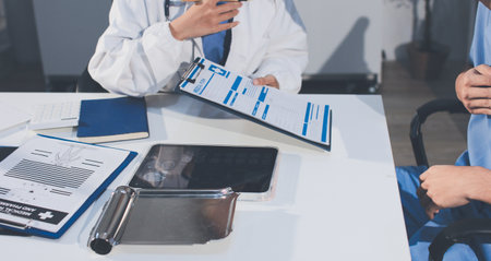 Young brunette woman having consultation at doctor office duringの写真素材