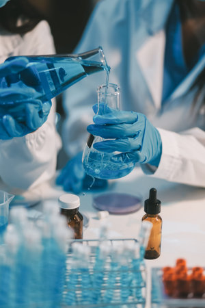 Research, experiment and medical trial being done by a scientist in a lab, science facility or hospital. One young, serious and professional researcher organizing, sorting or making a discoveryの写真素材