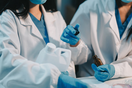Research, experiment and medical trial being done by a scientist in a lab, science facility or hospital. One young, serious and professional researcher organizing, sorting or making a discoveryの写真素材
