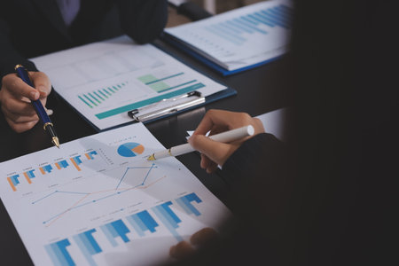 Team of business people working together in the meeting room office,
teamwork background charts and graphs banner, double exposure successful teamwork,business planning concept.の写真素材