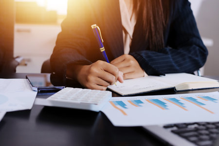 Team of business people working together in the meeting room office,
teamwork background charts and graphs banner, double exposure successful teamwork,business planning concept.の写真素材