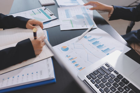 Team of business people working together in the meeting room office,
teamwork background charts and graphs banner, double exposure successful teamwork,business planning concept.の写真素材